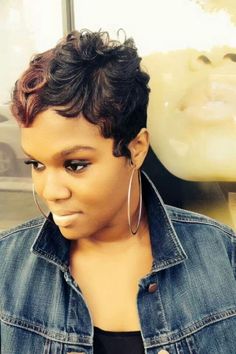 Touching short pixie haircut two way color African American